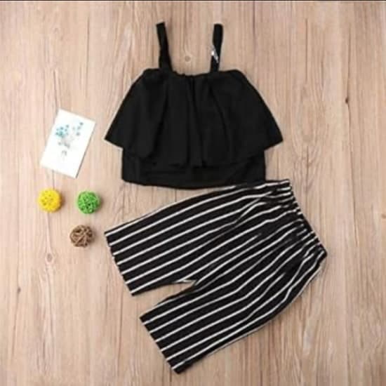 Black single sleeve shirt and black and white trouser